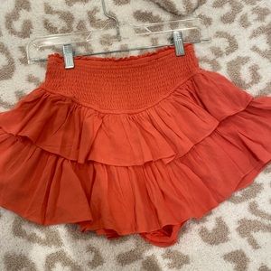 Salmon, colored rock and rag skirt